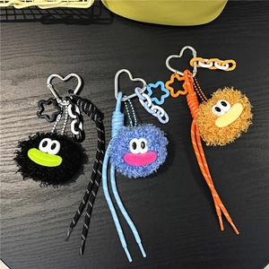 Three cute plush pompom keychains with woven ropes for bags and phone decoration