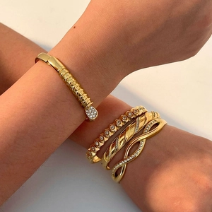 18k gold plated stainless steel bracelets with zircon inlay and twisted wave design