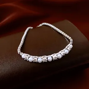 French style adjustable silver bracelet with round zircons and lustrous white pearls