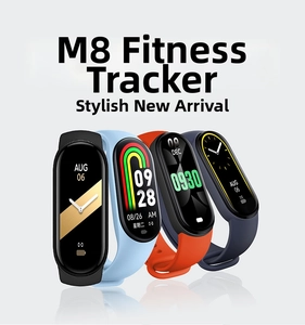 Detailed view of M8 smart fitness trackers in black, blue, and orange silicone straps