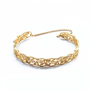 Detail of gold hollow leaf pattern silver bangle with adjustable security chain
