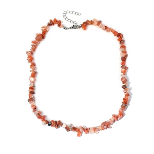 Macro detail of natural irregular orange crystal gravel necklace with silver lobster clasp