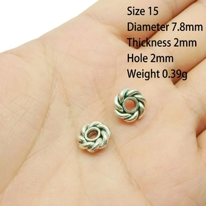 Macro view of 7.8mm silver alloy flower spacer beads for DIY jewelry making