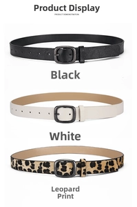 Close-up of black, white and leopard print skinny belts with vintage silver metal buckles