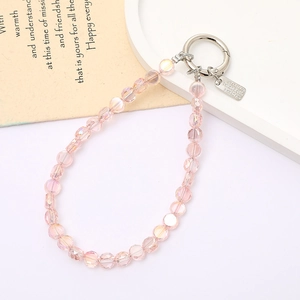 Pink faceted crystal beaded phone strap with silver metallic clasp and logo tag