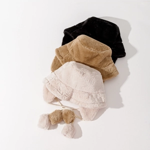 Three plush earflap bucket hats in black, khaki, and beige colors with cute pompom drawstrings