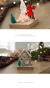 Close-up of wooden Christmas candle holder with red accents and a miniature pine tree