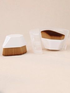 Detail of hexagonal foundation brush with dense bristles and clear protective case