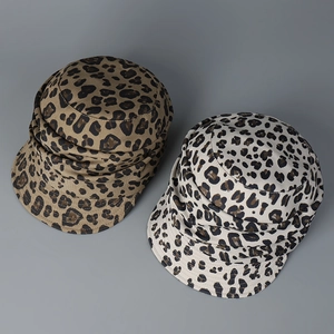 Detail view of cotton leopard print bucket hats in brown and beige color options