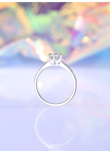 Detailed side view of 0.5ct moissanite ring with six-prong setting on S925 silver band