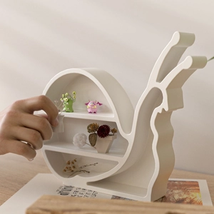 3-tier snail-shaped resin organizer rack with miniature figurines for home decor