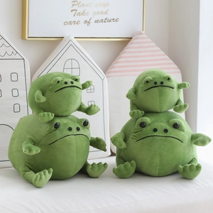 Close-up of stacked green frog plush toys in large and small sizes with soft fabric