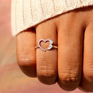 S925 silver heart ring with pink diamonds and cubic zirconia on a female finger