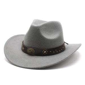 Detailed view of grey felt cowboy hat with vintage floral metal rivets and brown decorative band