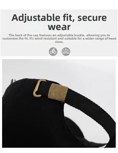 Detail of adjustable metal buckle and black twill strap on the back of baseball cap