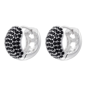 Detail of silver paved earrings featuring black stones and镂空heart-shaped cutouts on sides