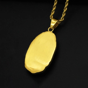 Polished gold finish on the reverse side of the Virgin Mary stainless steel pendant