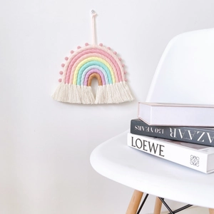 Handwoven macrame rainbow wall hanging with pastel cotton ropes and white tassels