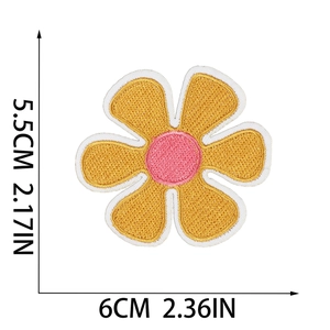 Detail view of flower sun embroidery patch showing 5.5cm x 6cm dimensions on white background