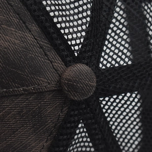 Detailed top view of a plaid baseball cap showing quality stitching and mesh panels