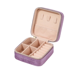 Portable purple velvet jewelry box with ring slots and compartments for storage