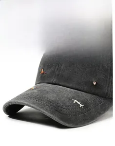 Close-up of vintage dark grey baseball cap with detailed puppy embroidery and stitching