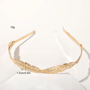 Detailed macro view showing the textured golden leaf pattern and metal finish of the headband