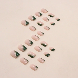 Short emerald green and nude marble press-on nails with white swirl lines and glossy finish