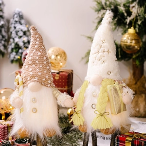 Lighted plush Christmas gnomes with sequins and warm lights for holiday window decoration