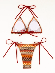 Detail view of the inner white padding and size S label on this boho knit bikini top