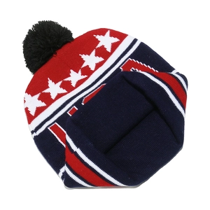Close-up of USA knit beanie featuring American flag stars and stripes with a black pompom
