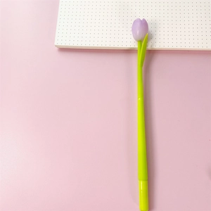 Detailed view of tulip gel pen with purple flower and green stem against a pink backdrop