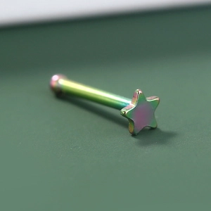 Macro shot of a rainbow metallic star-shaped nose stud with a glossy polished finish