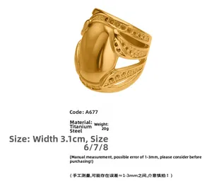 Detailed view of wide titanium steel ring with polished finish and hollow textures