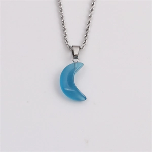 Detailed close-up of a blue moon-shaped stone pendant on a silver twist rope chain necklace