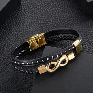 Detail of multi-layer leather bracelet with gold infinity charm and stainless steel clasp