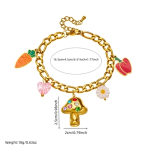 Fashion gold bracelet with cute mushroom carrot and heart charms on white background