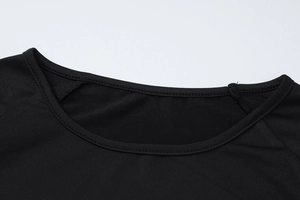 Close-up detail of smooth crew neck collar and high-quality stitching on black yoga top