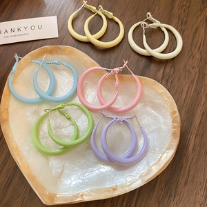 Detailed set of six pairs of colorful matte round hoop earrings in vibrant candy tones
