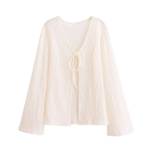 Women's white textured resort set with wide sleeve tie-up top and elastic waist shorts