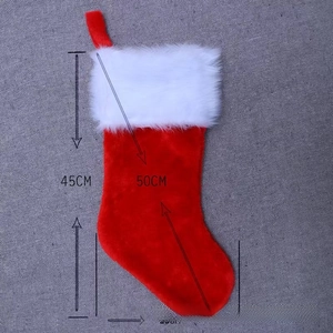 Detail of red plush Christmas stocking showing 45cm height and hanging loop on fabric