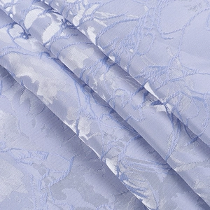 Detailed view of lavender jacquard fabric with elegant wavy texture and silky sheen