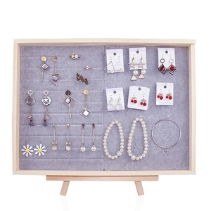 Vertical wooden jewelry display stand with gray velvet lining for earrings and rings