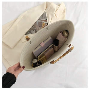 Top view of cream woven tote bag showing large capacity with bamboo handles