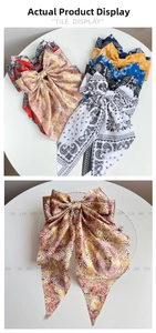 Detailed tile display of vintage floral print bow hair clips with long ribbon streamers