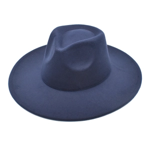 Detail of navy blue wool fedora hat with a wide brim and classic pinched crown design