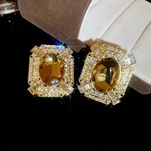 Vintage style square earrings with gold frame, amber stone and sparkling zircons