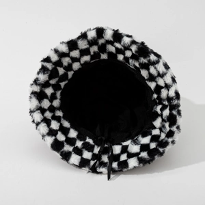 Checkerboard plush bucket hat with faux fur texture and adjustable inner drawstring