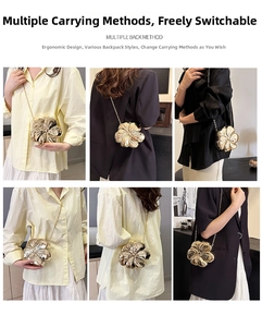 Detail of gold flower clutch bag showing 3D petal texture and metallic chain strap