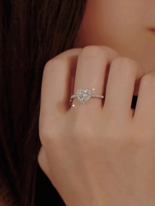 Exquisite S925 sterling silver heart-shaped moissanite ring with halo cluster on finger